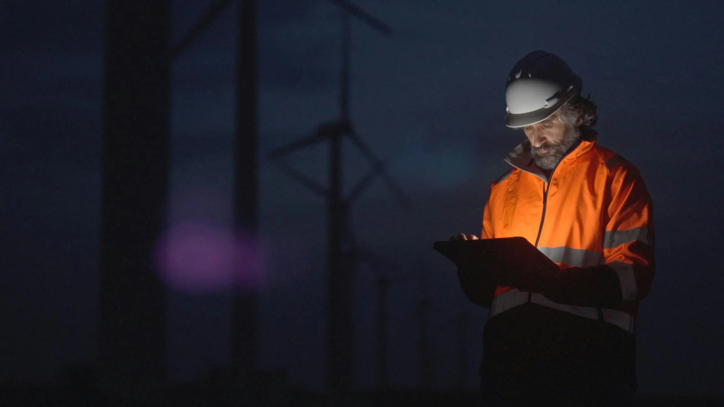 person on device among wind turbines person on device among wind turbines