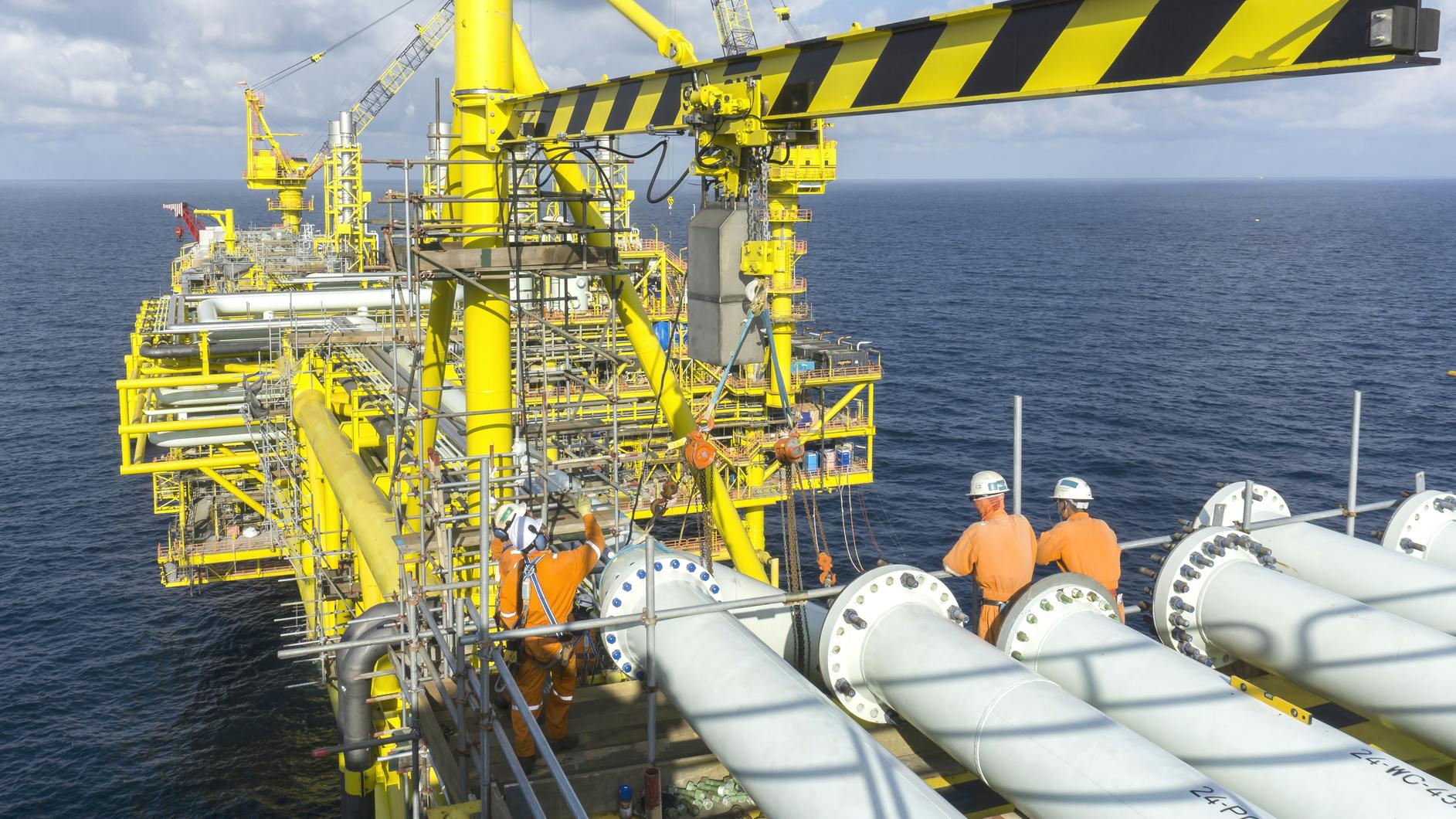 Offshore workers on oil and gas platform in South China Sea