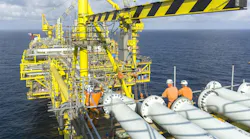 Offshore workers on oil and gas platform in South China Sea Offshore workers on oil and gas platform in South China Sea