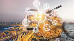 Double exposure of hand using a phone with digital icons with offshore oil and gas platform in background