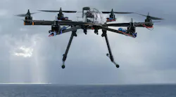 Hexacopter drone flying over the ocean