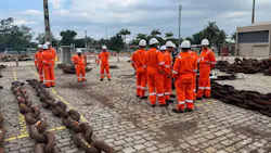 Intermoor offshore workers gather around mooring chains in Brazil
