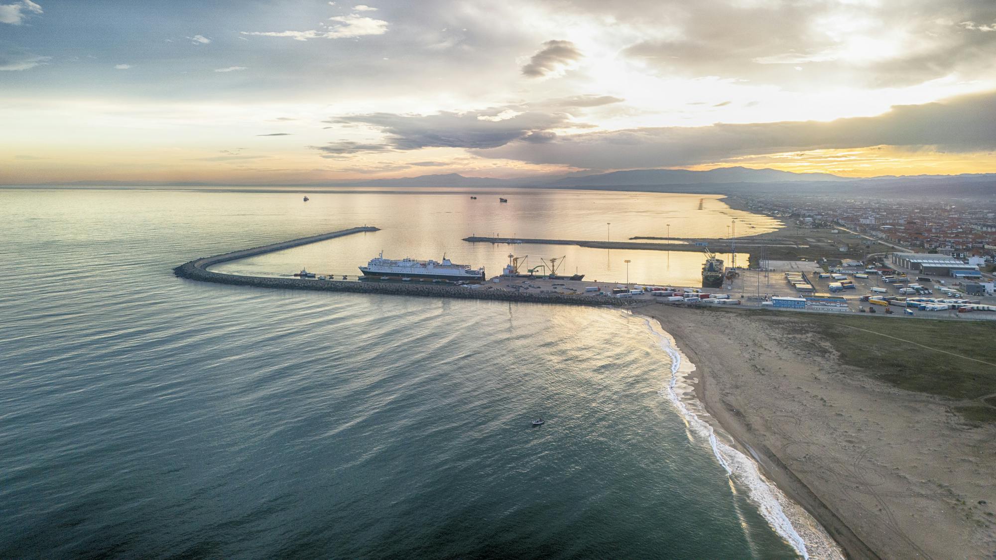 Drone shot over Turkiye Provides Aerial View of a Busy Port at Sunset