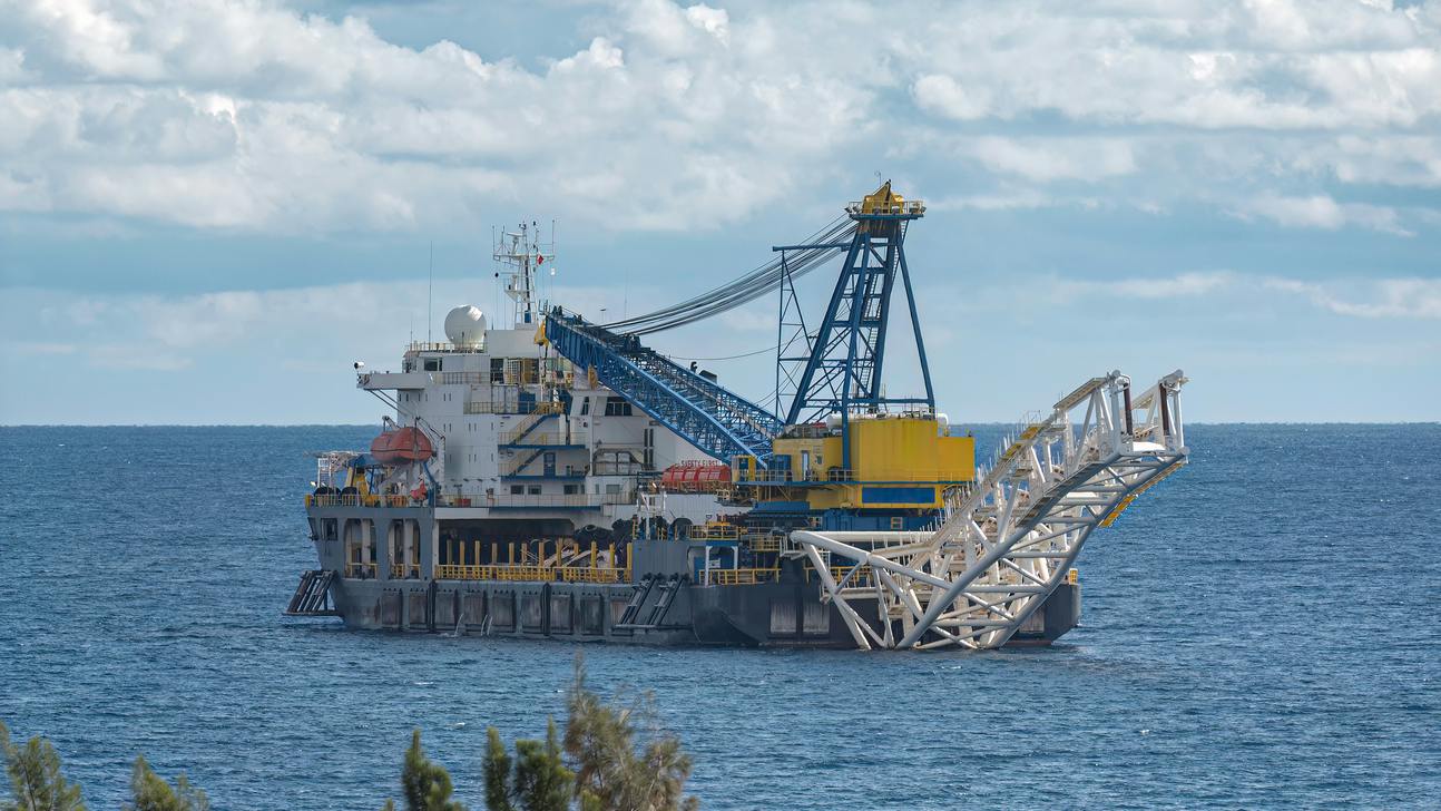 An offshore construction vessel installs subsea pipeline infrastructure
