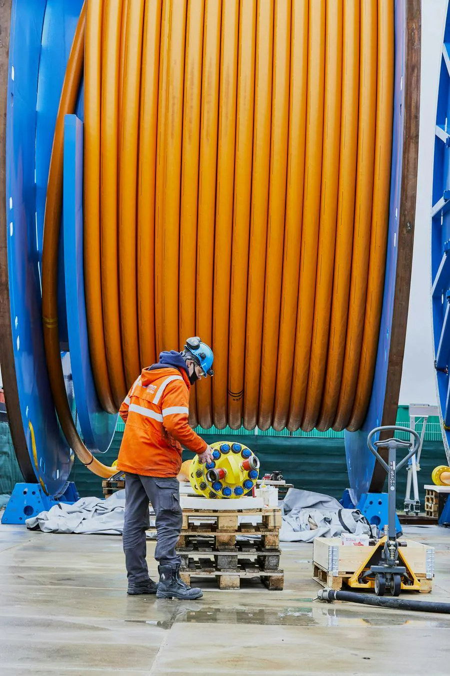 Technician working in front of TCP spool